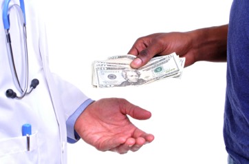 patient giving doctor cash