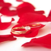 rose petals and wedding ring
