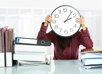 business woman with clock in front of face