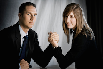 man and woman arm wrestling