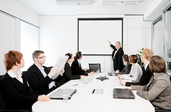 professionals sitting around conference room table